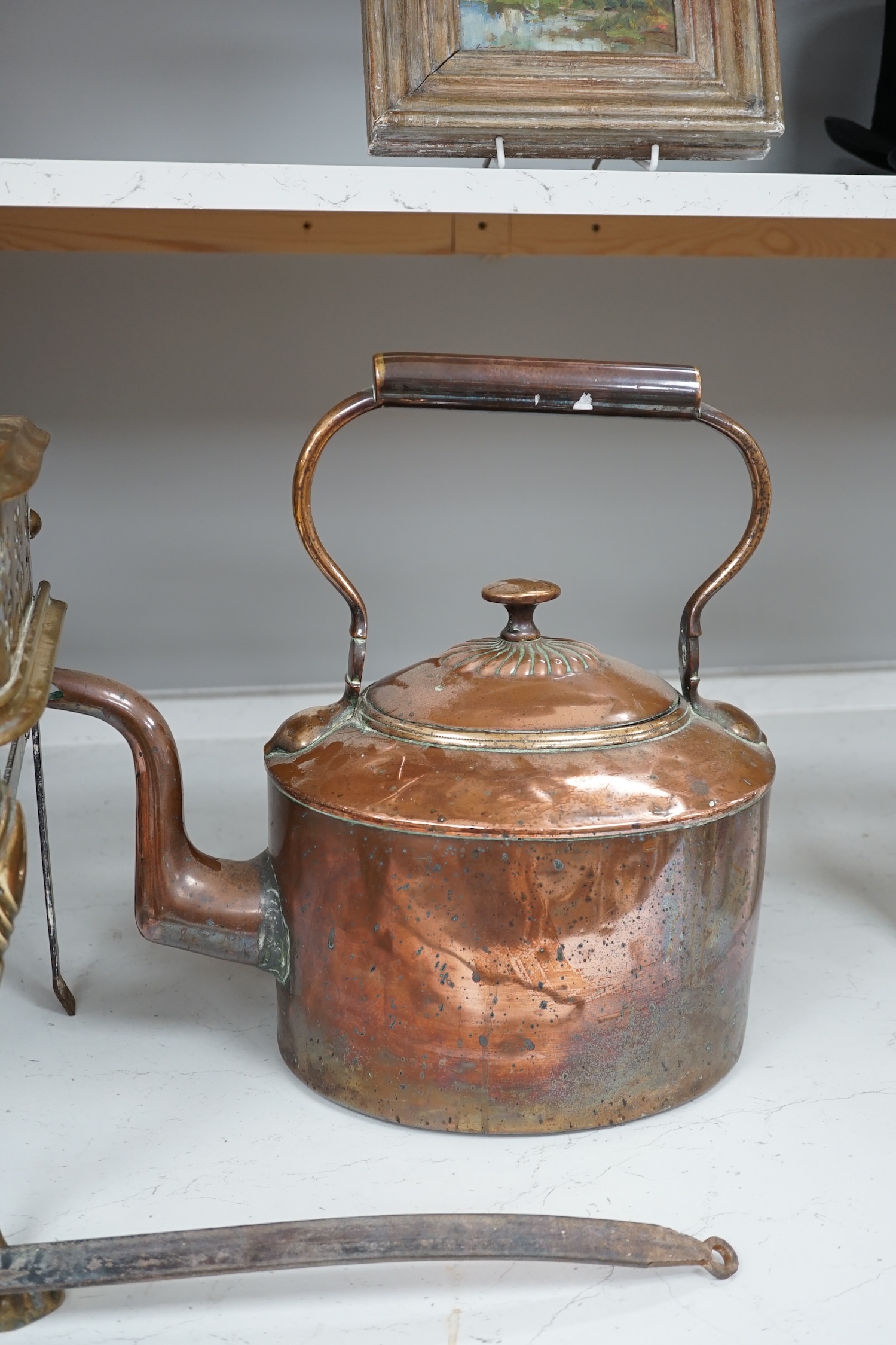 A late Victorian copper kettle, a brass stand and a ladle, largest 39cm wide. Condition - fair